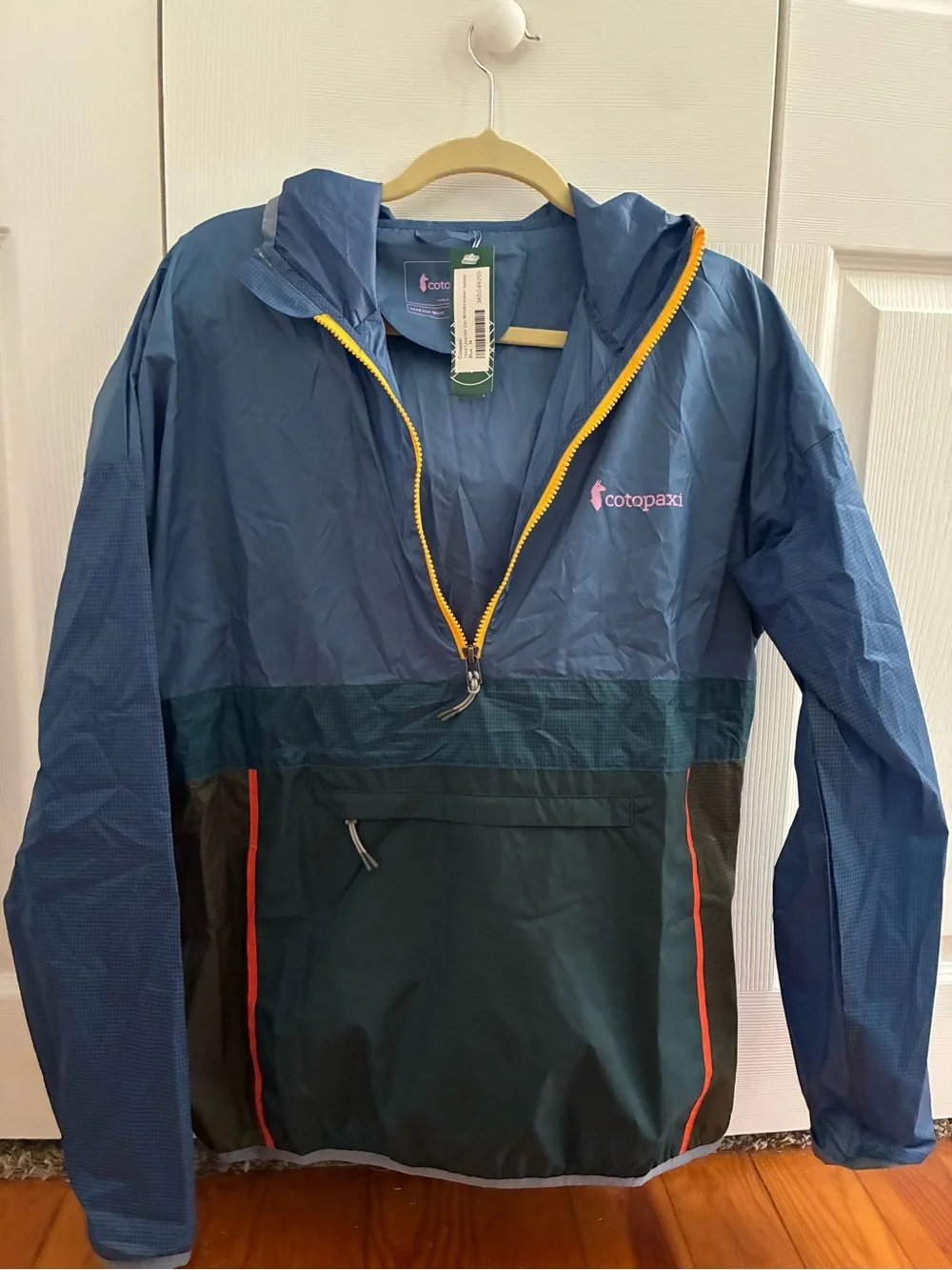 cotopaxi Navy Jacket with Yellow Zipper and Pink Logo